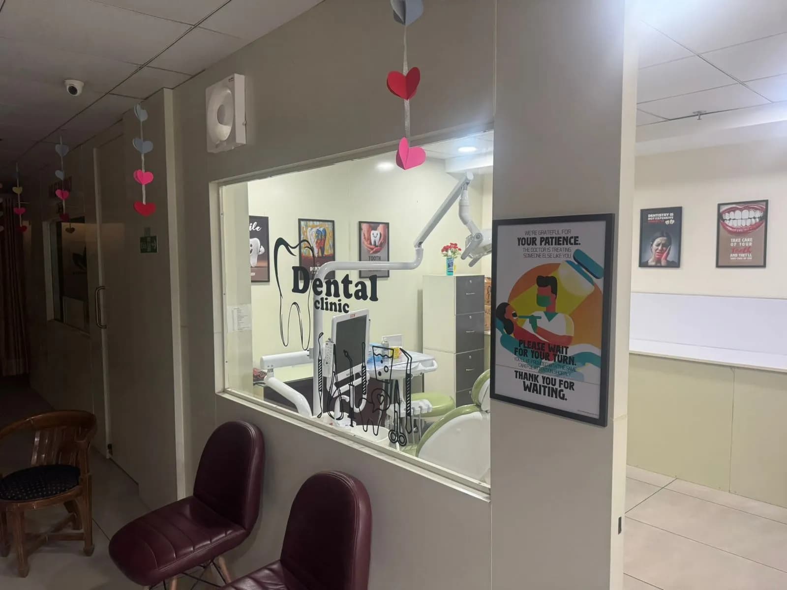 Seating outside the treatment room, with a clear view in.