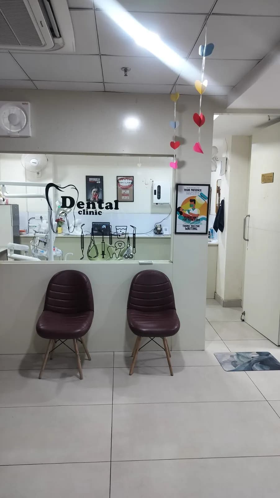 The waiting area, with two chairs beside the reception counter.
